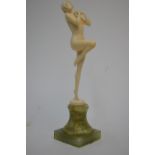 A 1930s Art Deco ivory figure after Ludwig Walther, female nude, standing on one leg, on onyx