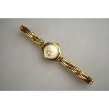 A lady's Rotary 9ct gold wristwatch with 15 jewel movement on expanding two-bar bracelet strap,