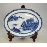 A Chinese Export blue and white tureen stand, or other dish, decorated with a mountainous river