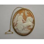 An oval shell cameo of female with lyre board a horse-drawn chariot,