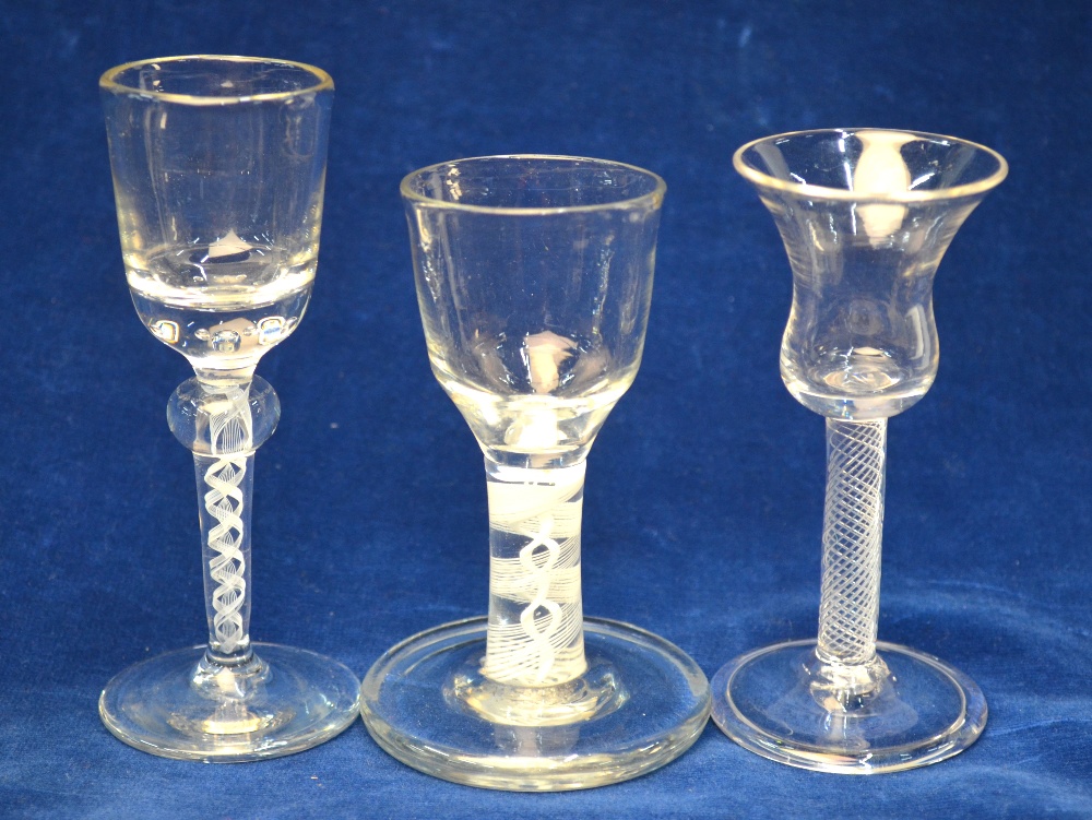 An 18th century firing glass, ogee bowl, multiple spiral opaque twist stem, broad flat foot and - Image 2 of 4