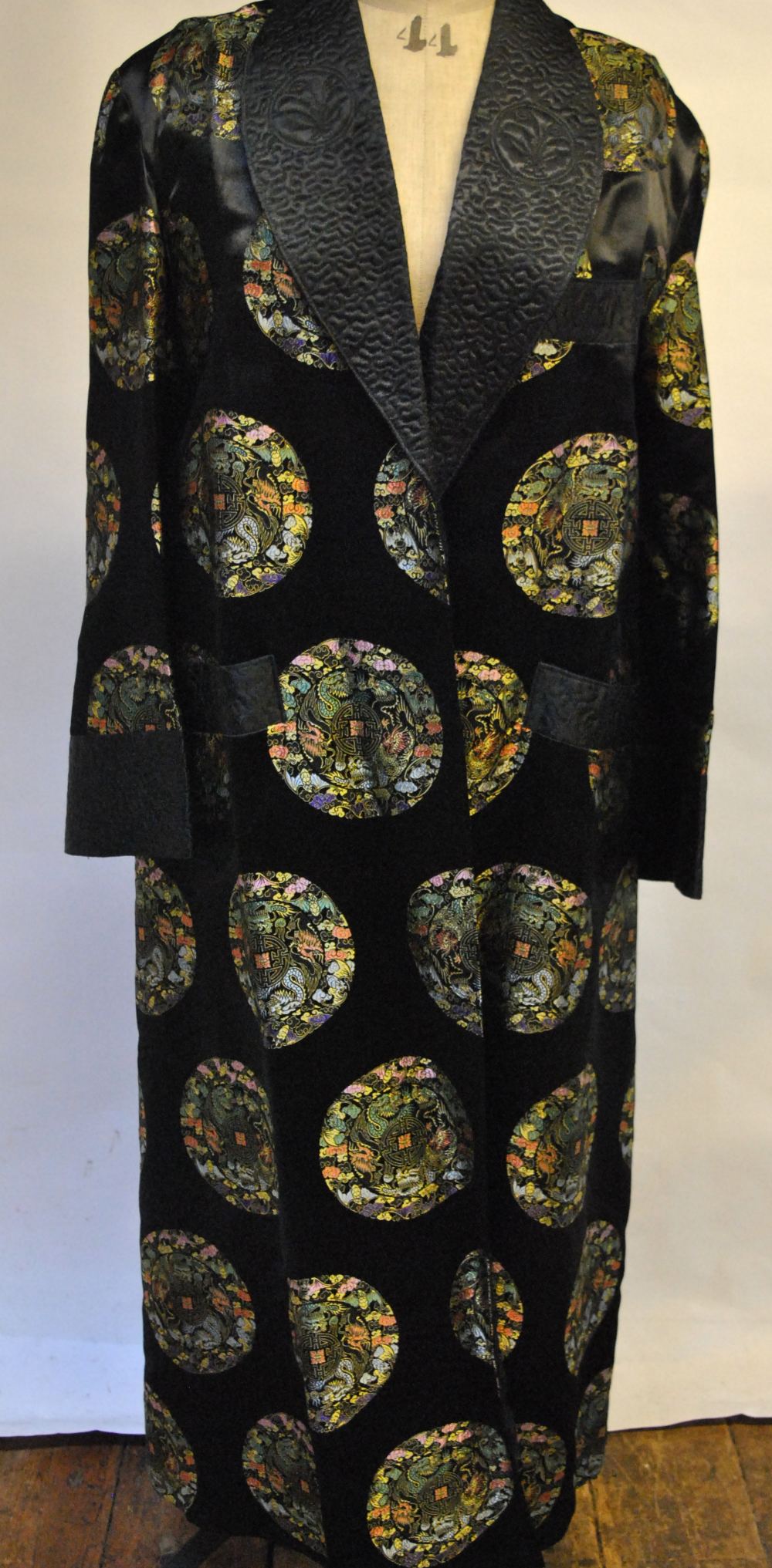 A gentleman's Chinese black satin dressing gown embroidered with stitched roundels, to/w a vintage