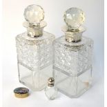 A pair of square-cut glass decanters and stoppers with silver collars, Preece & Williscombe,