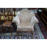 A pair of salon armchairs with flared arms and yoke backs,