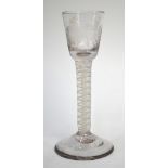 An 19th century cordial glass, the round funnel bowl with engraved floral border, double series