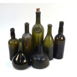 Seven old wine/beer bottles, all with kick-in bases,