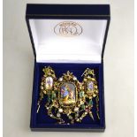 A 19th century gilt metal baroque pendant/brooch set with a Neo-classical ceramic plaque
