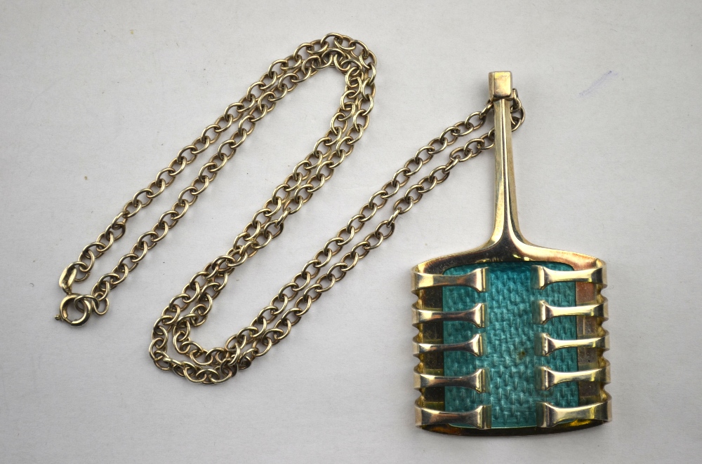 David Anderson Norway - a silver pendant of wrap around style over turquoise enamel
