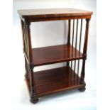An early Victorian rosewood three tier whatnot with baluster supports and reeded bun feet, 61 cm