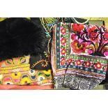 A box of Indian mirrored and other embroidered textiles, a box of silk fabric pieces including a