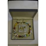 A contemporary Venetian glass multi-coloured bead necklace to/w a pair of matching earrings (one