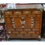 A Chinese rectangular wood chest in two parts with metal fittings, and an arrangement of drawers,