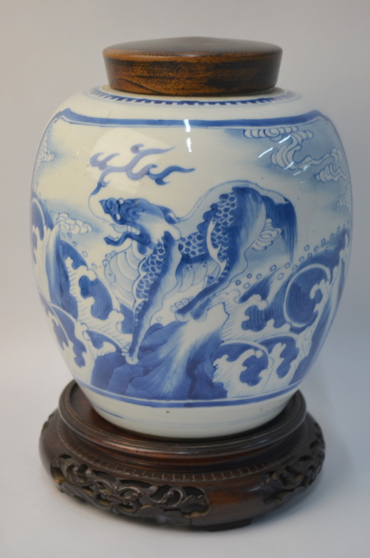 A blue and white oviform vase, decorated with two panels depicting Kylin,