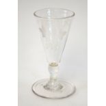 An 18th century small ale glass etched with barley and hops, short baluster stem, flat base and