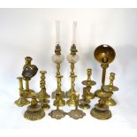 Six various pairs of antique brass candlesticks, to/w a pair of oil lamps with cut glass fonts and