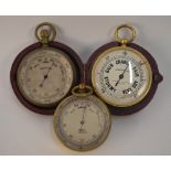 A Negretti & Zambra gilt brass pocket barometer with silvered dial, in fitted leather case, to/w two