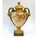 A large Royal Worcester blush ground twin handle vase and cover, painted with branches of nuts or