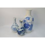 Three blue and white Chinese vases; the largest, 36 cm high, with Qianlong four-character mark,