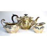A heavy quality silver three-piece tea service of bombe form with scroll handles, James Deakin &