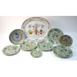 A large Chinese famille rose oval dish, decorated with Scholar's objects,