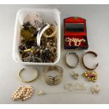 A collection of vintage and later costume jewellery including necklaces, bracelets, chains,