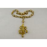 A mid 20th century cultured baroque pearl and gold pendant necklace,