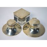 Two weighted silver capstan inkwells,