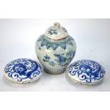 A pair of Chinese blue and white circular boxes;