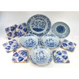 A Chinese Export blue and white dish with chocolate rim, decorated with a garden and floral design,