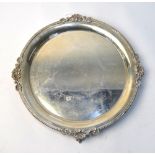 A silver letter salver with shell-cast and dragooned rim, on four claw and ball feet, Garrard &