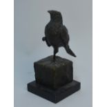 A brown-patinated bronze bird standing on one leg,on cube plinth and slate base, signed 'Milo',