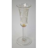 An 18th century ale glass, bell shaped bowl etched with a bird in flight, barley and hops, plain