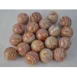 A quantity of antique glass marbles, red-brown /opaque approx. 1 inch (25 mm) diameter (20)