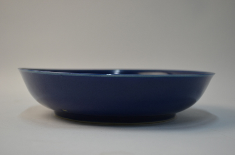 A pair of Chinese blue monochrome saucer dishes; 21 cm diameter. - Image 4 of 4