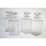 A set of four early 19th century square chamfered decanters having cut shoulders and rims
