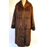 A squirrel fur coat with deep collar and concealed side pockets, 53 cm across chest