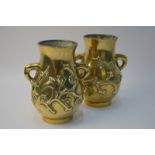 A pair of Chinese gilded metal vases;