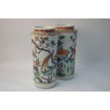 A pair of Chinese cylindrical vases, decorated in coloured enamels with birds,