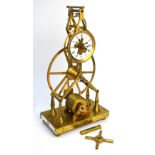 A brass skeleton clock with wire fusee movement (late 20th century),