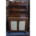 A small George IV mahogany chiffonier with two stepped open shelves above twin doors with latticed
