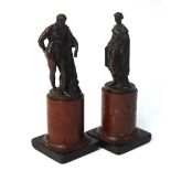 A pair of 19th century brown patinated bronze figures of male and female classical Greek figures,