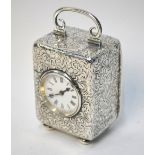 An Edwardian silver-cased boudoir clock with French movement, enamel circular dial,