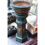 A polychrome glazed planter with stand,