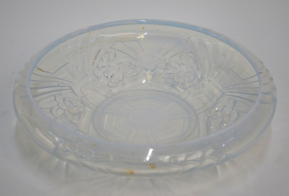 A French opalescent glass Art Deco bowl with inverted rim moulded with flower heads and geometric