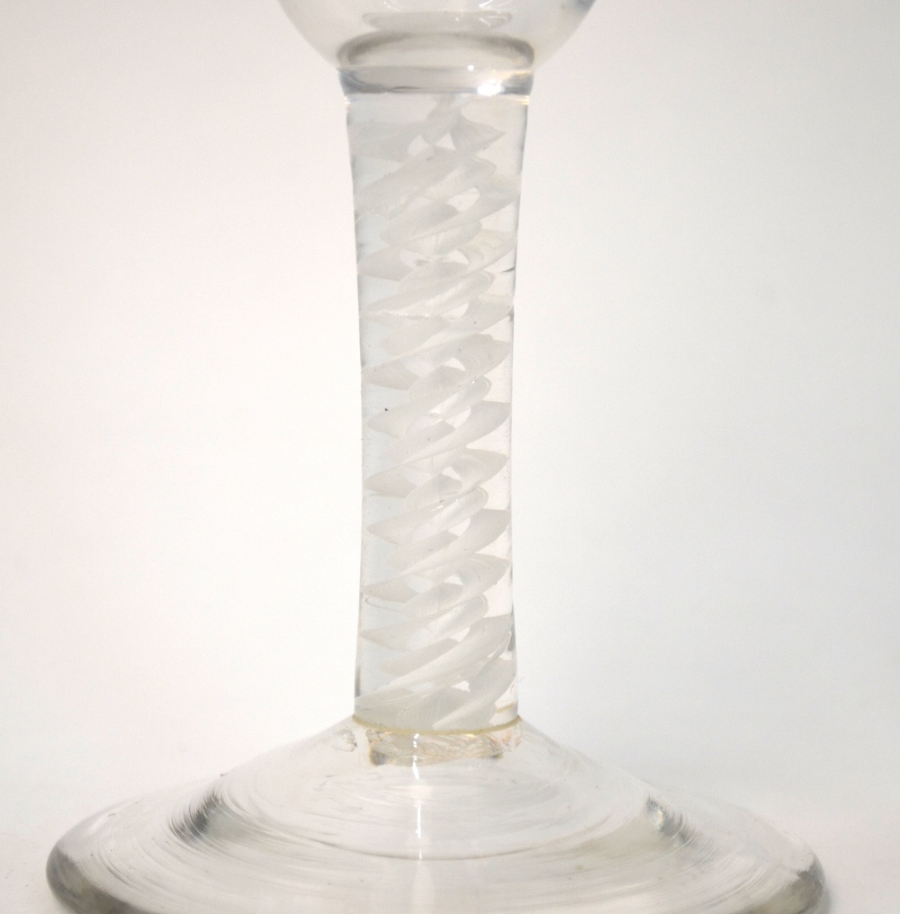 An 18th century ale glass, rounded funnel bowl, multiple spiral opaque twist stem, domed foot and - Image 2 of 4