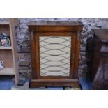 A Victorian inlaid walnut pier cabinet, the single door with brass lattice grill, on plinth base, 76