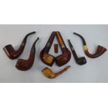 An Edwardian meerschaum pipe with 9ct gold band and amber stem (a/f),