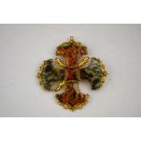 A brown and green moss agate brooch of quatrefoil design,