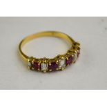 A diamond and ruby half hoop ring set five baguette cut diamonds and four mixed cut rubies,