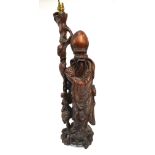 A Chinese standing hardwood figure of the Daoist,